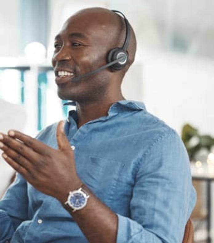 A VVM agent wearing a headset during a friendly call